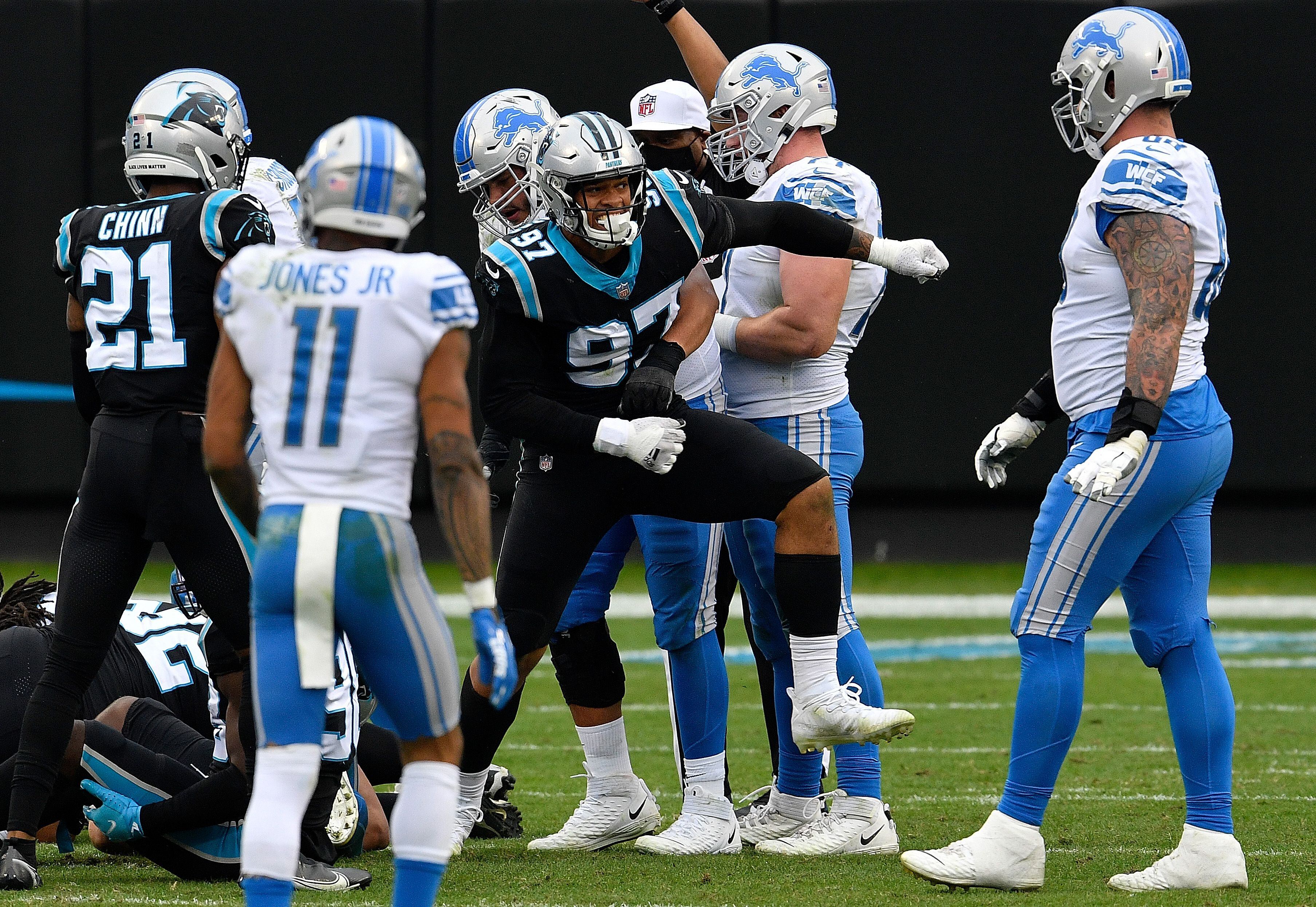 Charlotte, NC USA; Carolina Panthers quarterback Sam Darnold (14) runs in  for a touchdown during an NFL game against the Detroit Lions at Bank of  America Stadium, Saturday, December 24, 2022. The