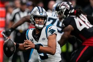 Robinson outshines top pick Young, Falcons beat Panthers