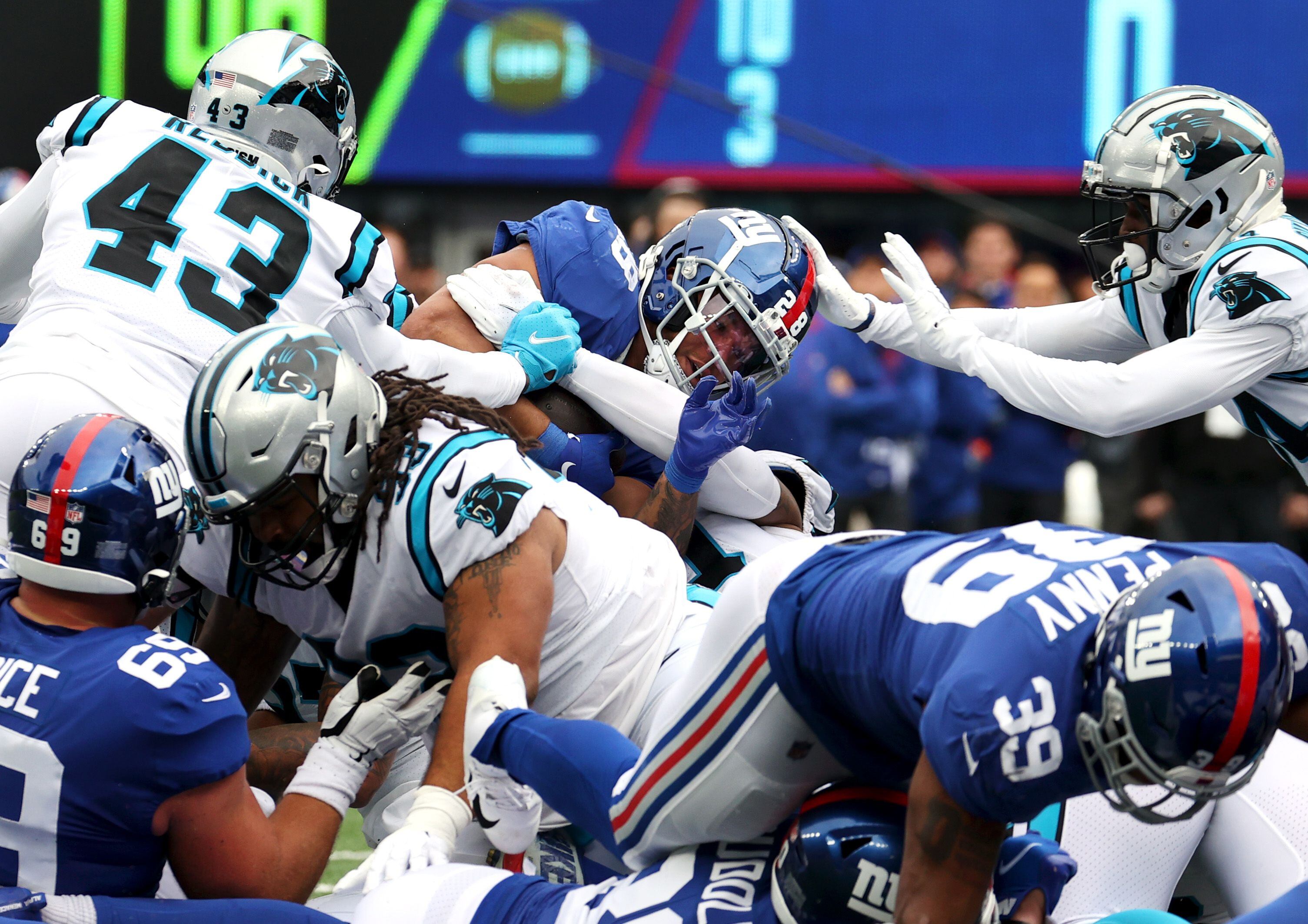 Jones passing and catching, Giants D spark win over Panthers - The