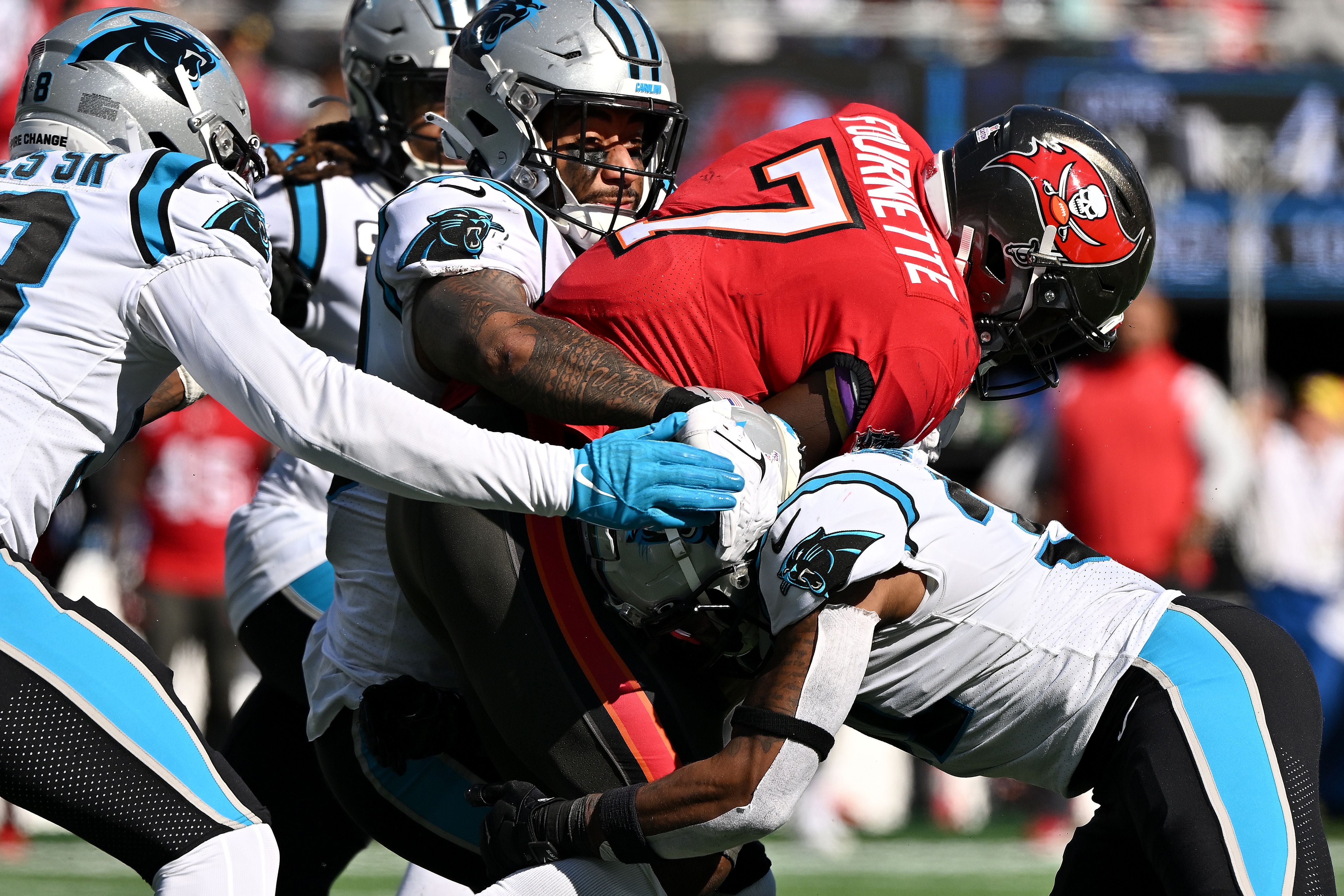 Carolina Panthers running back Chuba Hubbard (30) takes a handoff from  quarterback PJ Walker (11) during an NFL football game against the Tampa  Bay Buccaneers on Sunday, Oct. 23, 2022, in Charlotte