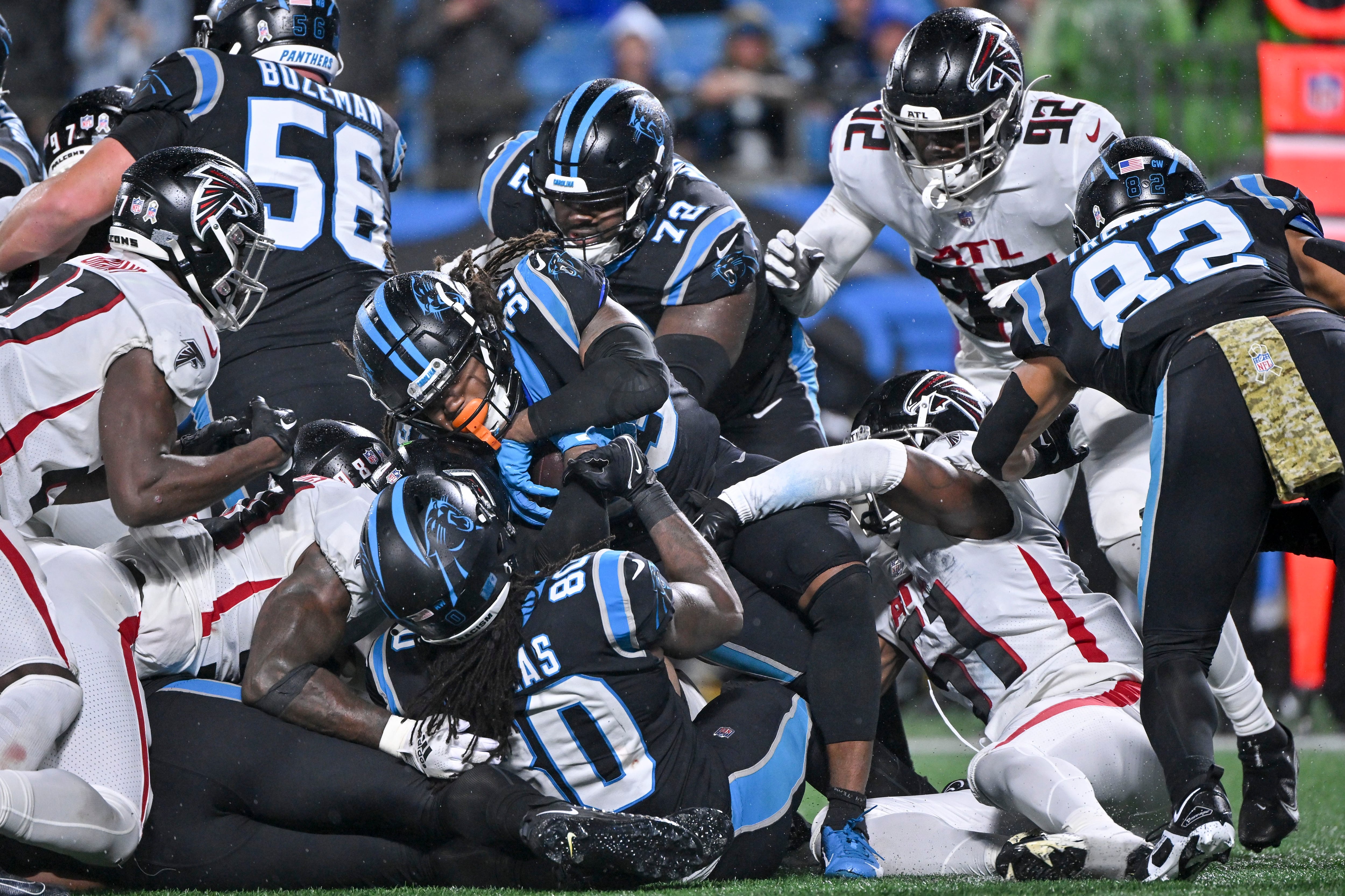 Foreman leads Panthers past rival Falcons in rain, 25-15